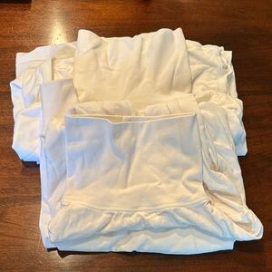 Two Lands' End Cream Super-T Turtleneck Shirts in size Large.